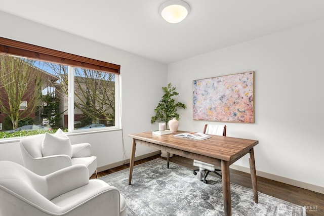 office featuring baseboards and wood finished floors