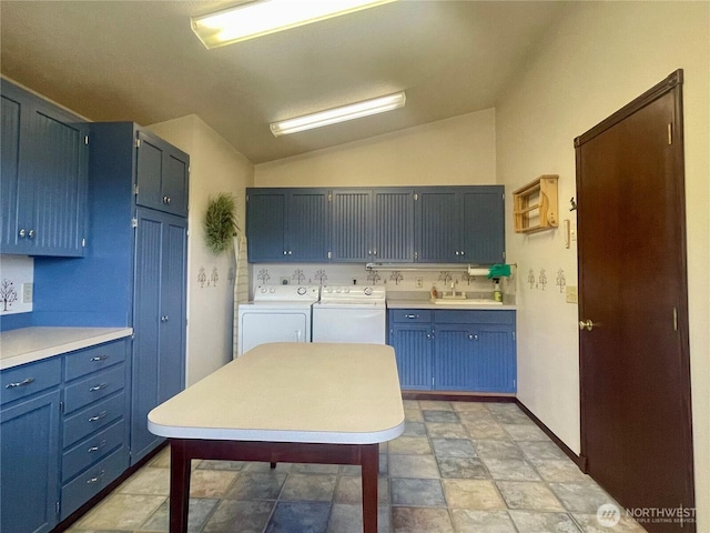 laundry room featuring washer and dryer, cabinet space, and a sink