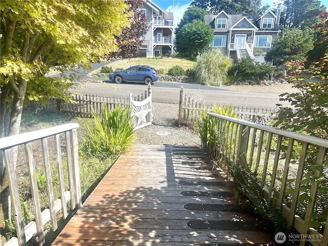 view of community featuring fence