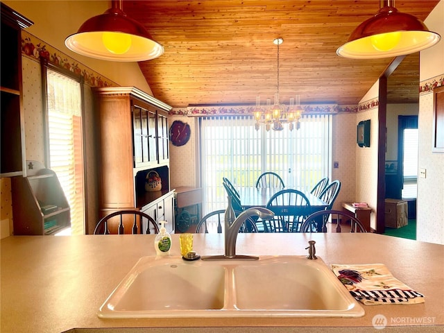 dining room with an inviting chandelier, a healthy amount of sunlight, wooden ceiling, and vaulted ceiling