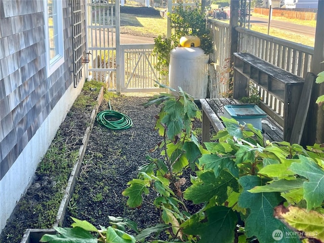 exterior details with heating fuel and fence