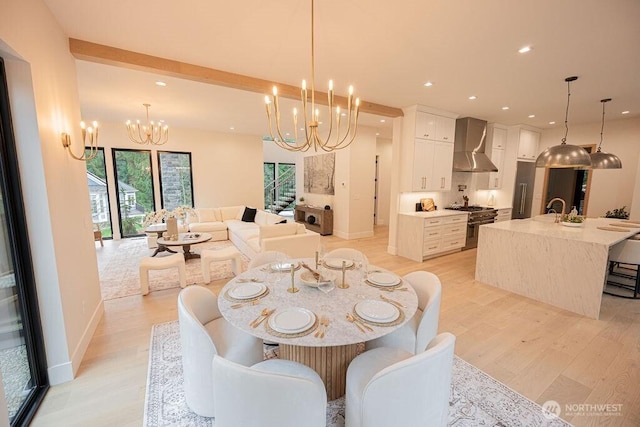 dining area featuring recessed lighting, baseboards, light wood-style floors, and an inviting chandelier