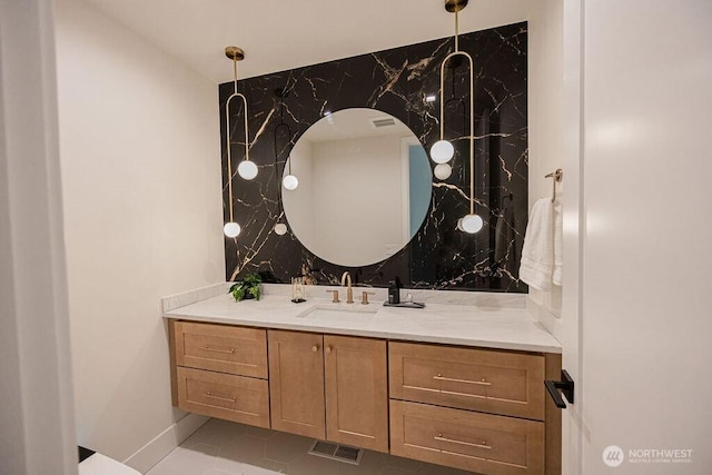 bathroom with vanity and visible vents