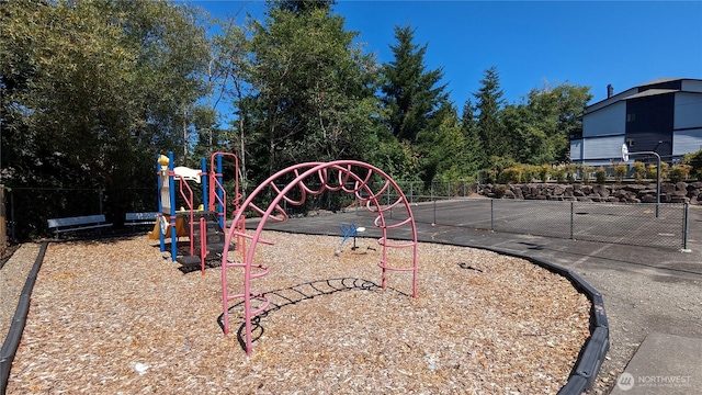 communal playground featuring fence