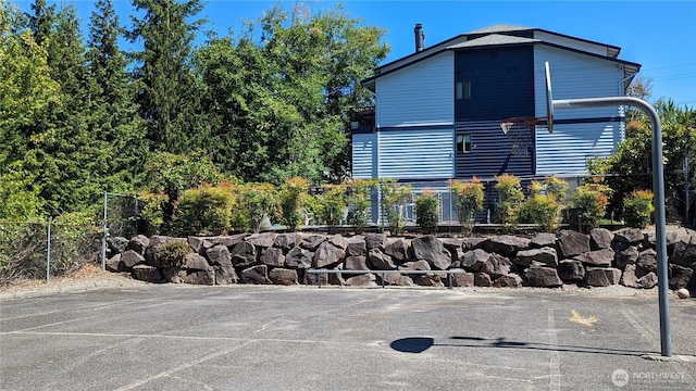 view of property exterior with fence