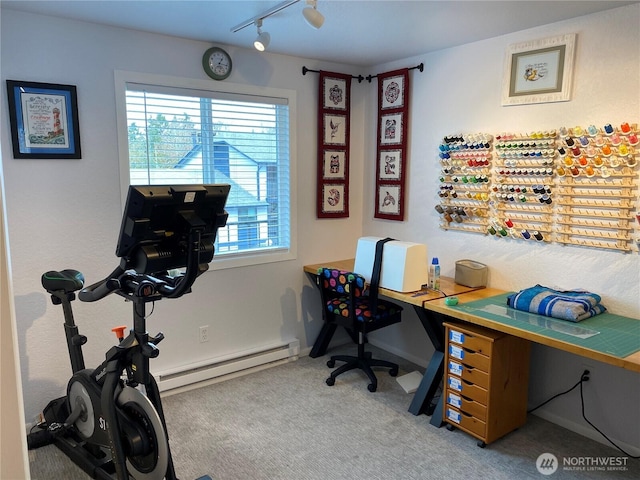 office featuring track lighting, carpet, baseboards, and baseboard heating