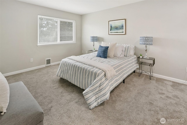 carpeted bedroom featuring visible vents and baseboards