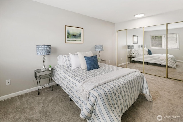 bedroom featuring carpet flooring, baseboards, and a closet