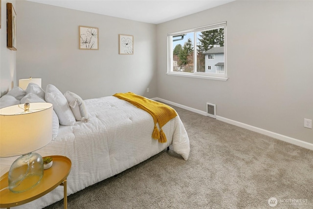bedroom featuring carpet flooring, visible vents, and baseboards
