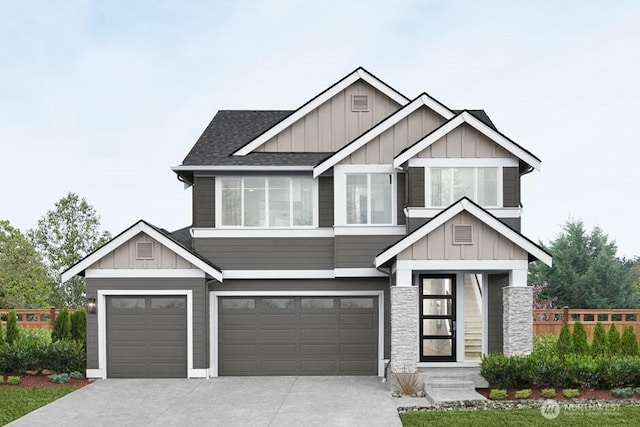 craftsman-style home featuring board and batten siding, an attached garage, driveway, and roof with shingles