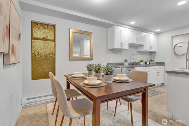 kitchen featuring baseboard heating, recessed lighting, dishwasher, and white cabinetry