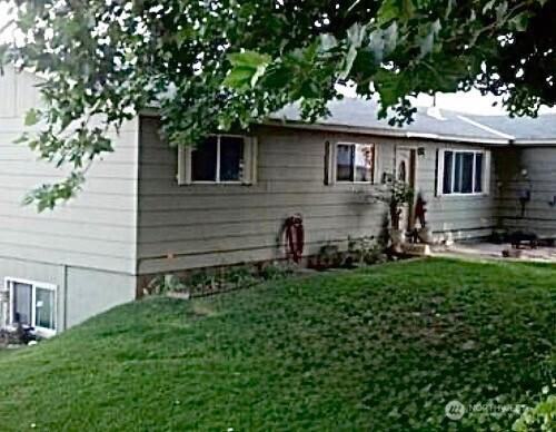 rear view of house with a lawn