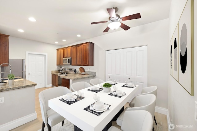 12601 172nd St E Unit Jj102, Puyallup, WA 98374 - dining space featuring baseboards, recessed lighting, a ceiling fan, and light wood-style floors