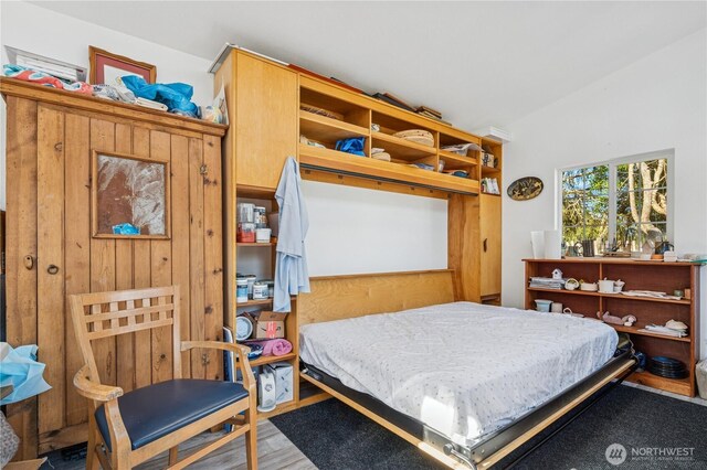 bedroom with wood finished floors