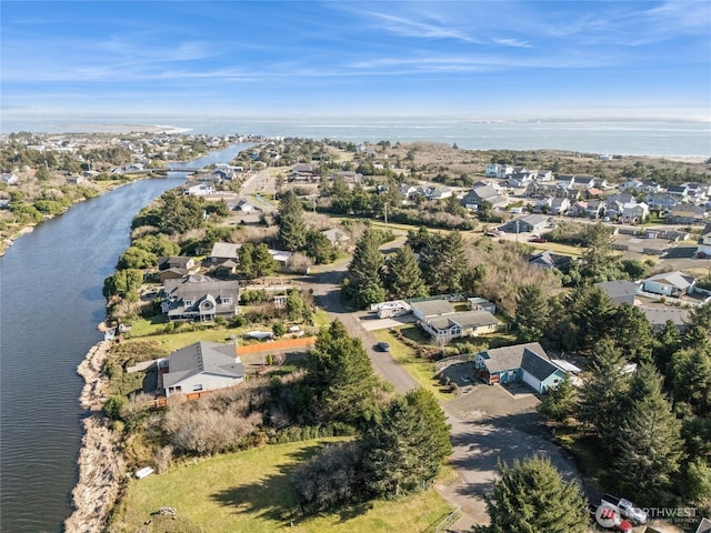 bird's eye view featuring a residential view and a water view