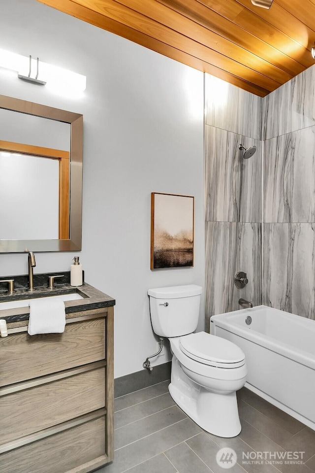 full bathroom featuring vanity, toilet, bathing tub / shower combination, and tile patterned flooring