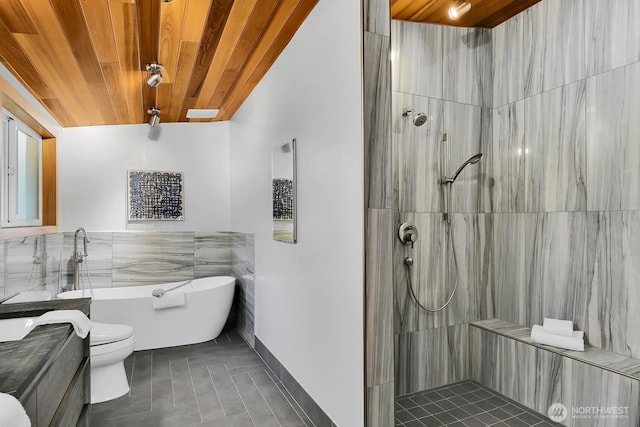 bathroom with tile patterned floors, a tile shower, wooden ceiling, a freestanding bath, and vanity