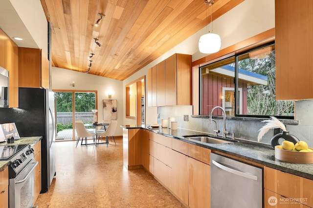 kitchen featuring a sink, appliances with stainless steel finishes, decorative backsplash, lofted ceiling, and wood ceiling