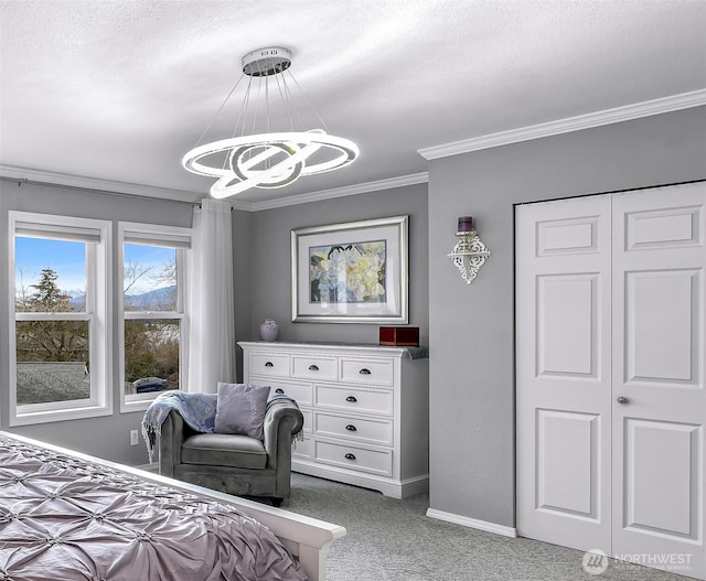 carpeted bedroom with baseboards, a textured ceiling, an inviting chandelier, and ornamental molding