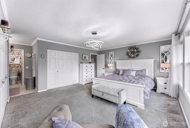 bedroom featuring a closet, baseboards, carpet, and ornamental molding