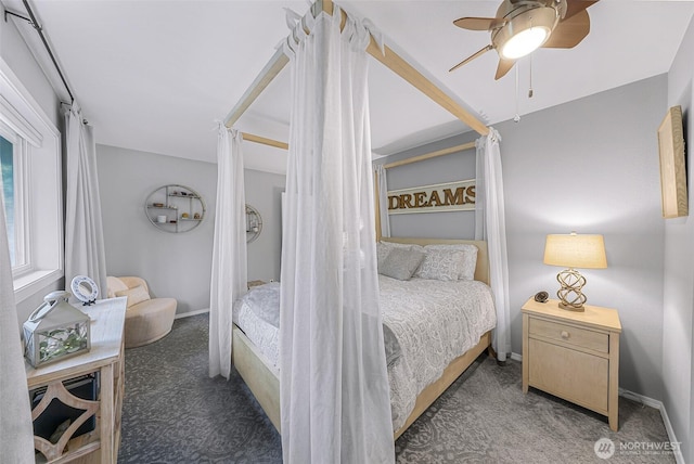 bedroom featuring ceiling fan, baseboards, and carpet