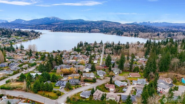 bird's eye view with a residential view and a water and mountain view