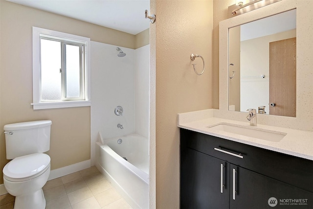 bathroom with tile patterned floors, toilet, baseboards, bathing tub / shower combination, and vanity