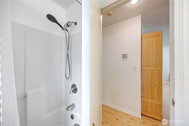 bathroom with  shower combination and wood finished floors