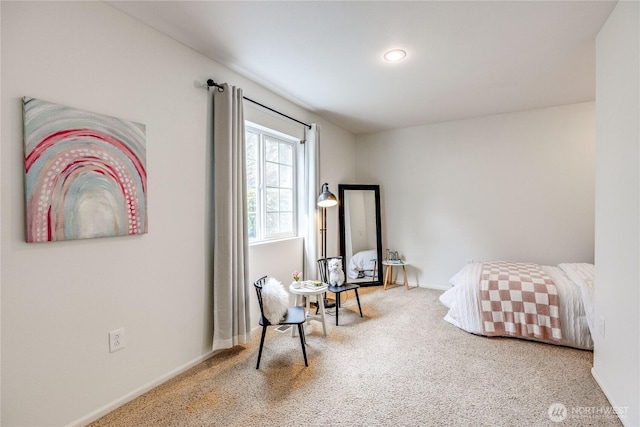 carpeted bedroom with baseboards