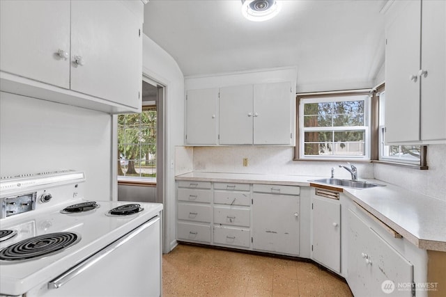 kitchen with a sink, white cabinetry, white range with electric stovetop, light countertops, and light floors