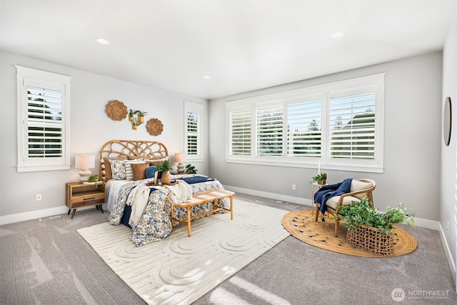 carpeted bedroom featuring recessed lighting and baseboards