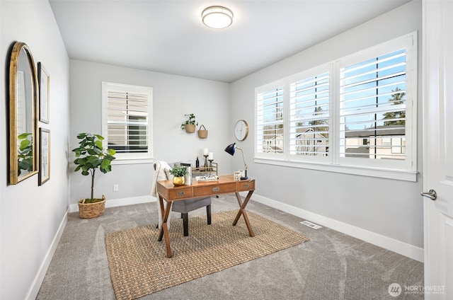 home office with visible vents, baseboards, and carpet floors