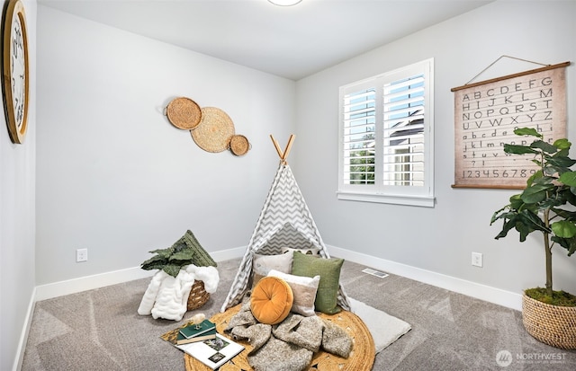 rec room with visible vents, baseboards, and carpet flooring