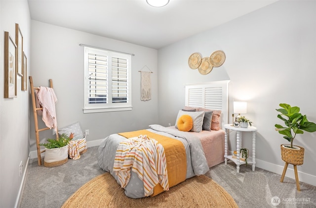 bedroom featuring baseboards and carpet flooring