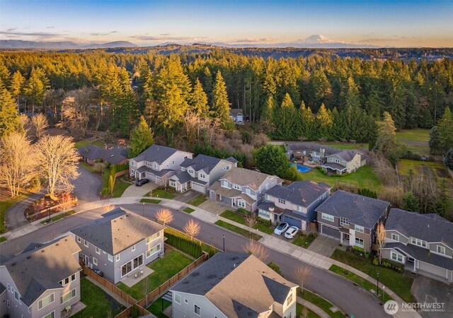 bird's eye view with a residential view and a view of trees