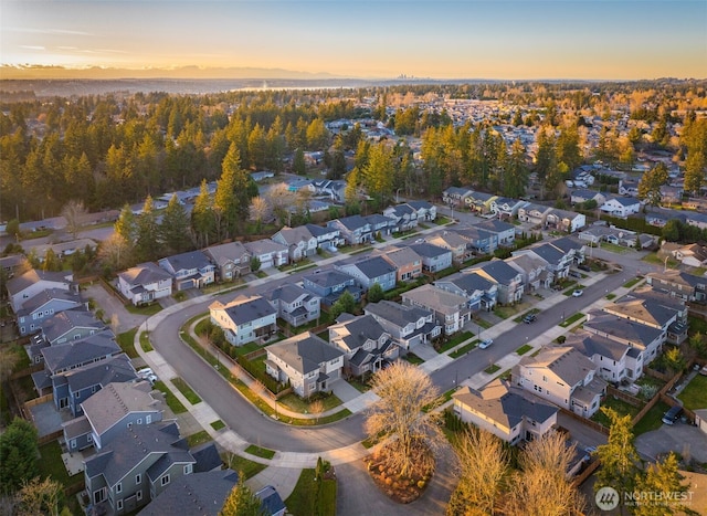 birds eye view of property with a residential view