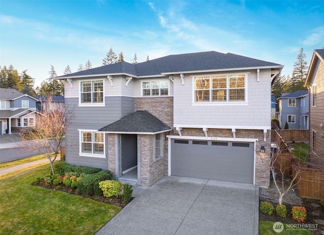 view of front of home featuring stone siding, roof with shingles, concrete driveway, and an attached garage