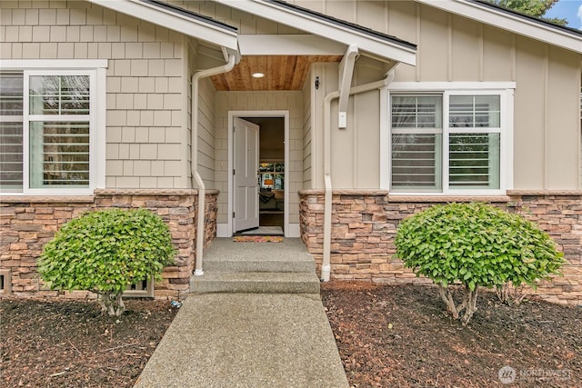 entrance to property with stone siding