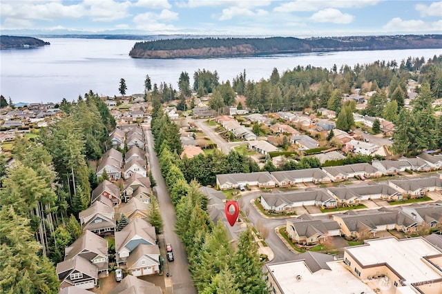 drone / aerial view with a residential view and a water view