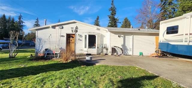 view of front facade with a front yard and metal roof