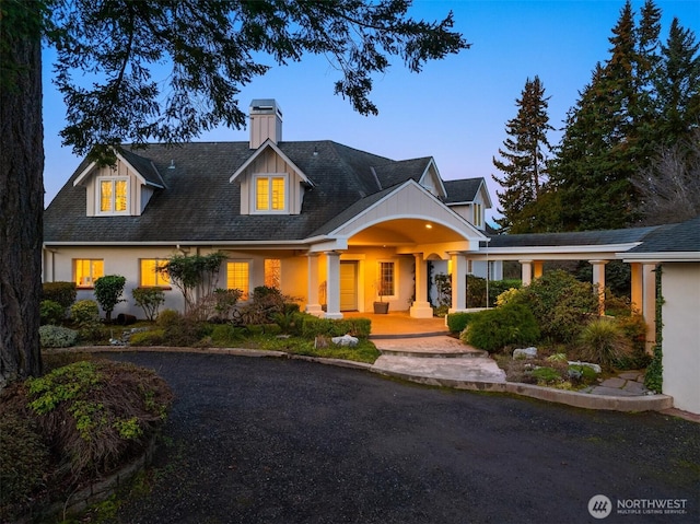 view of front of property with a chimney