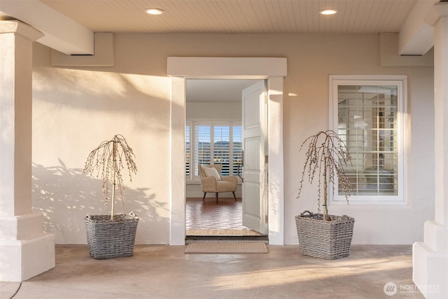 doorway to property with stucco siding