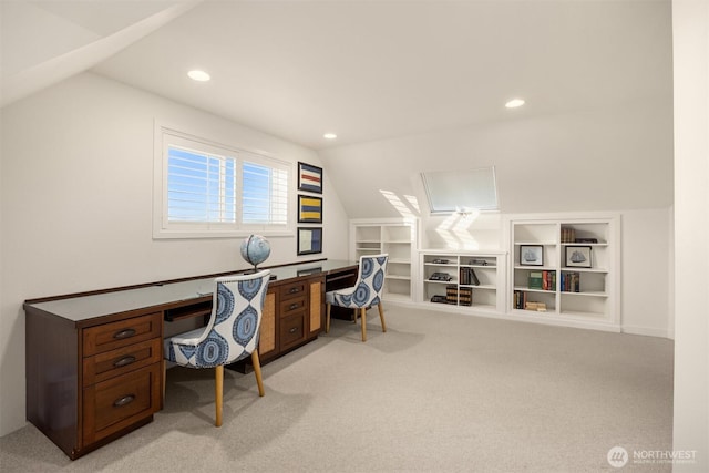 office featuring recessed lighting, light colored carpet, lofted ceiling, and built in features