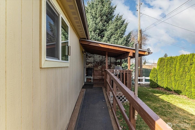 view of side of home with fence