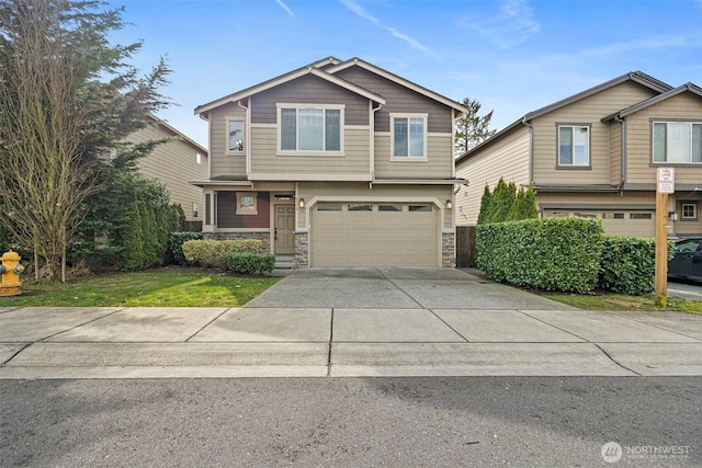 craftsman-style house featuring stone siding, concrete driveway, and an attached garage