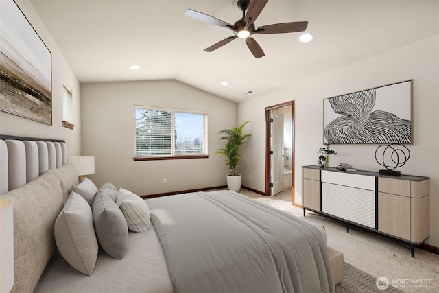 bedroom with baseboards, recessed lighting, vaulted ceiling, light carpet, and connected bathroom