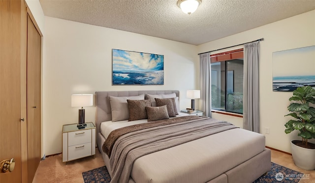 bedroom with baseboards, light carpet, and a textured ceiling