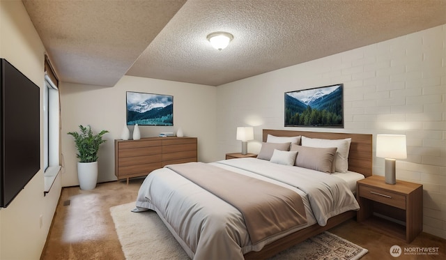 bedroom with carpet floors and a textured ceiling