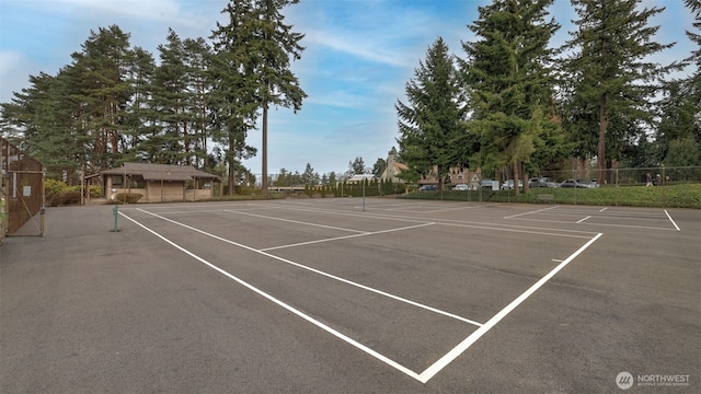 view of sport court with fence