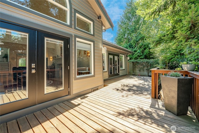 deck with french doors and fence